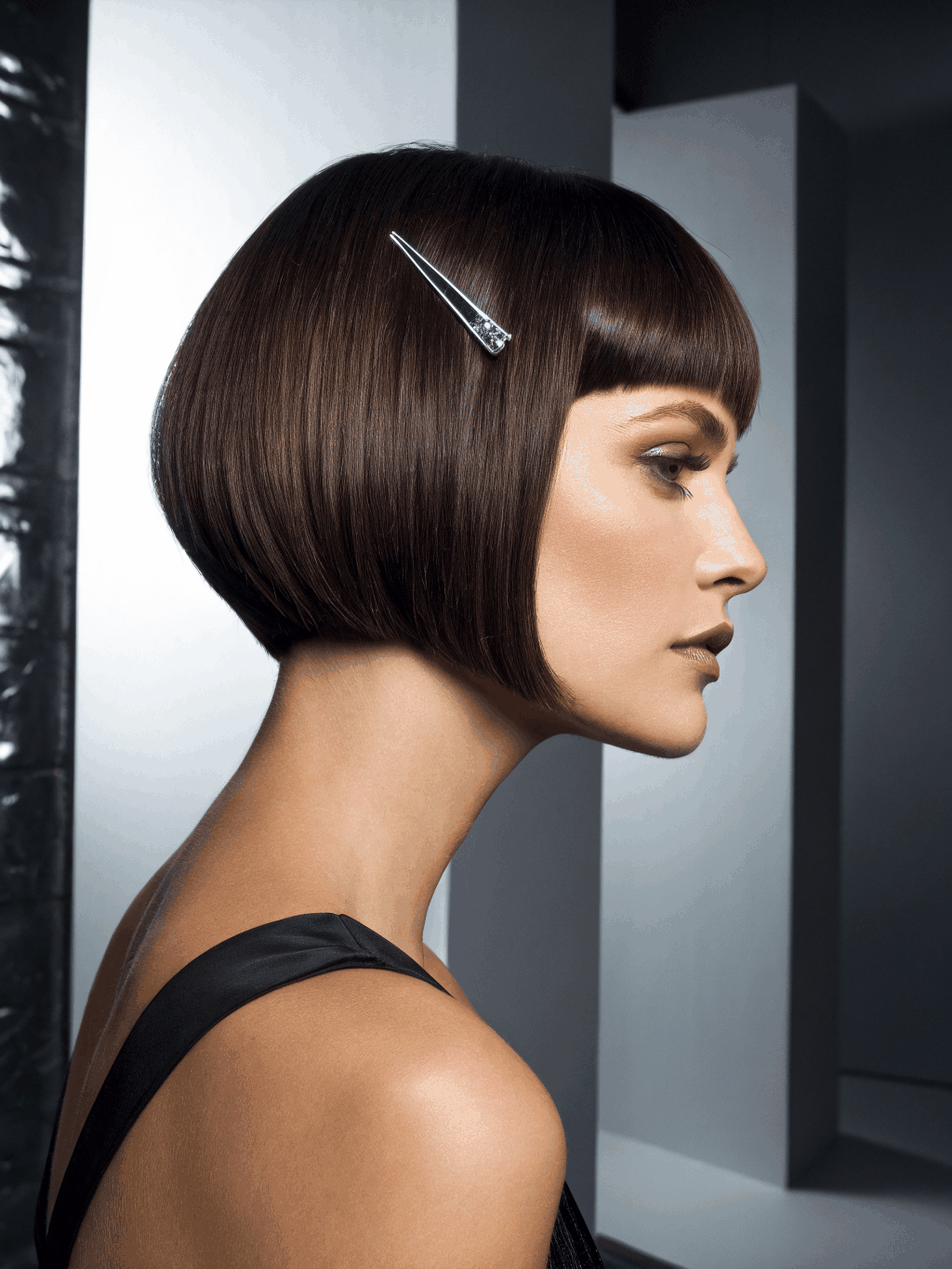 Sharp architectural bob cut in a studio setting